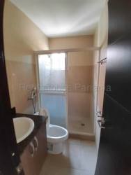 Modern bathroom with glass shower enclosure vanity tile floor beach house Panama