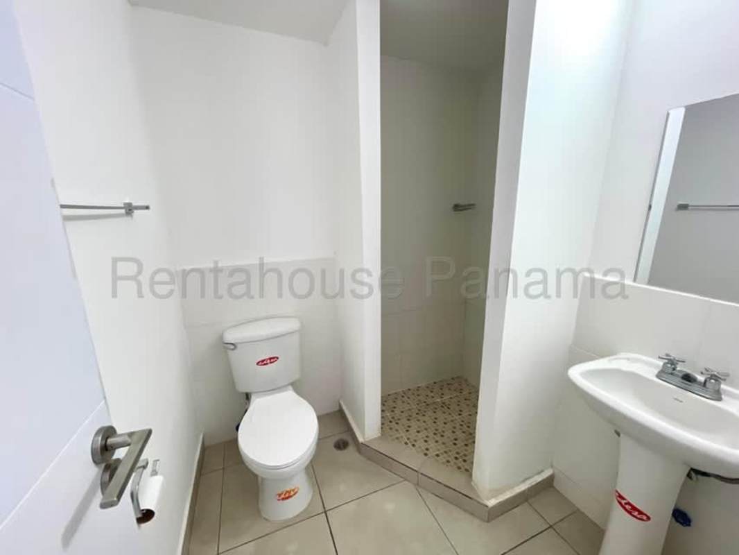 Modern bathroom with glass-enclosed shower, sink vanity, tiled walls PH Alai Panama