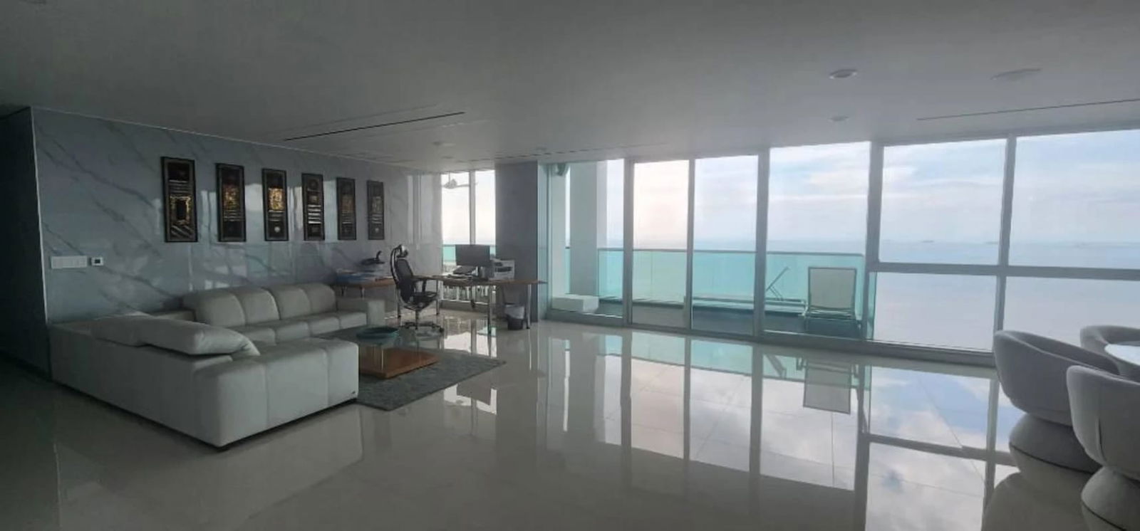 Modern high-rise apartment kitchen and dining with city views, Scavolini cabinetry in The Regent Costa del Este