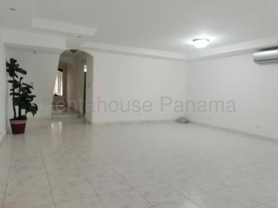 Living room with tiled floor ceiling fan AC unit Betania Panama house for sale