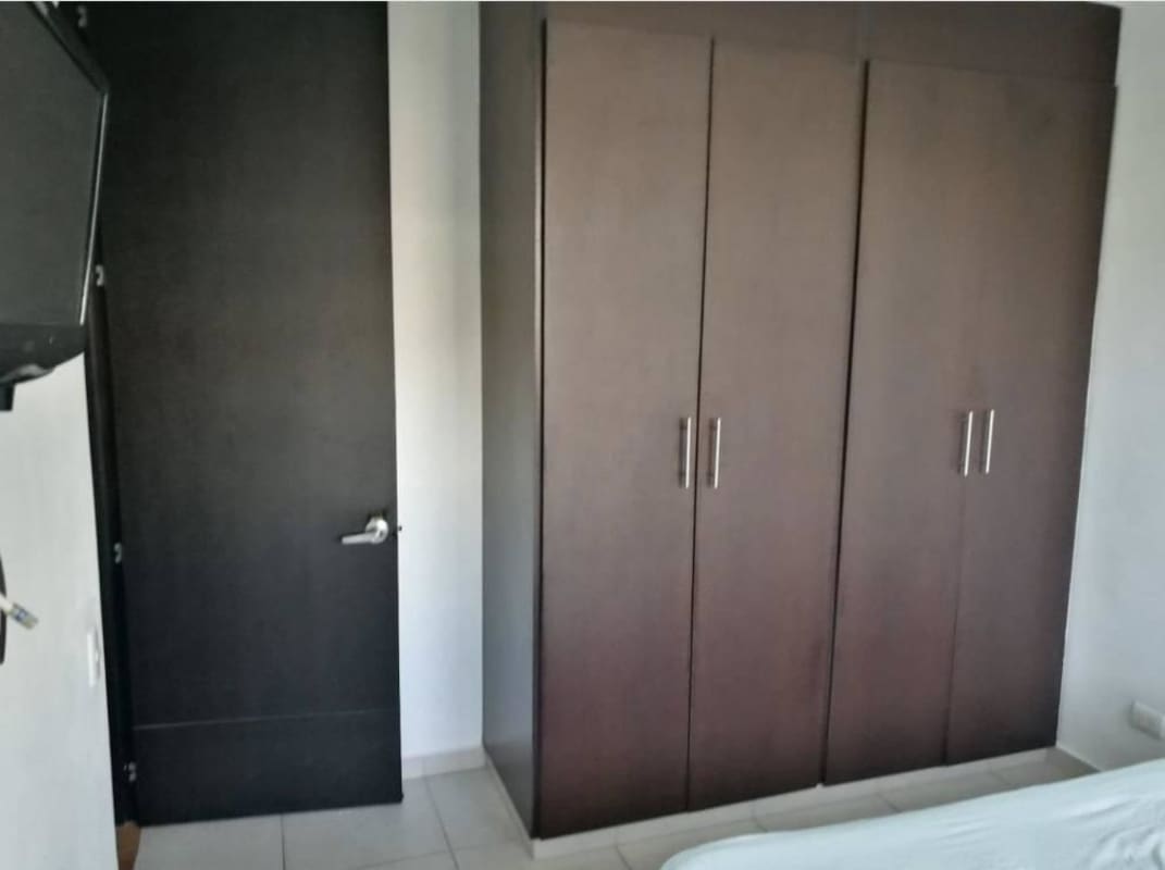 Modern living and dining room with wood flooring, large window to terrace, Alsacia Towers Panama rental