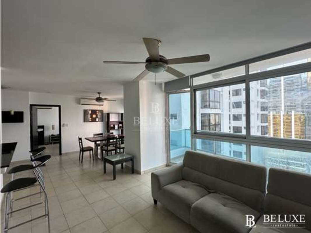 Floor-to-ceiling windows with ocean and city views in furnished apartment PH Bayfront Avenida Balboa Panama