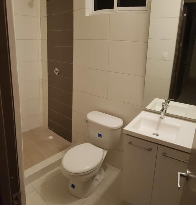 Modern bathroom with glass-enclosed shower and vanity sink in PH Cantabria Las Acacias Panama