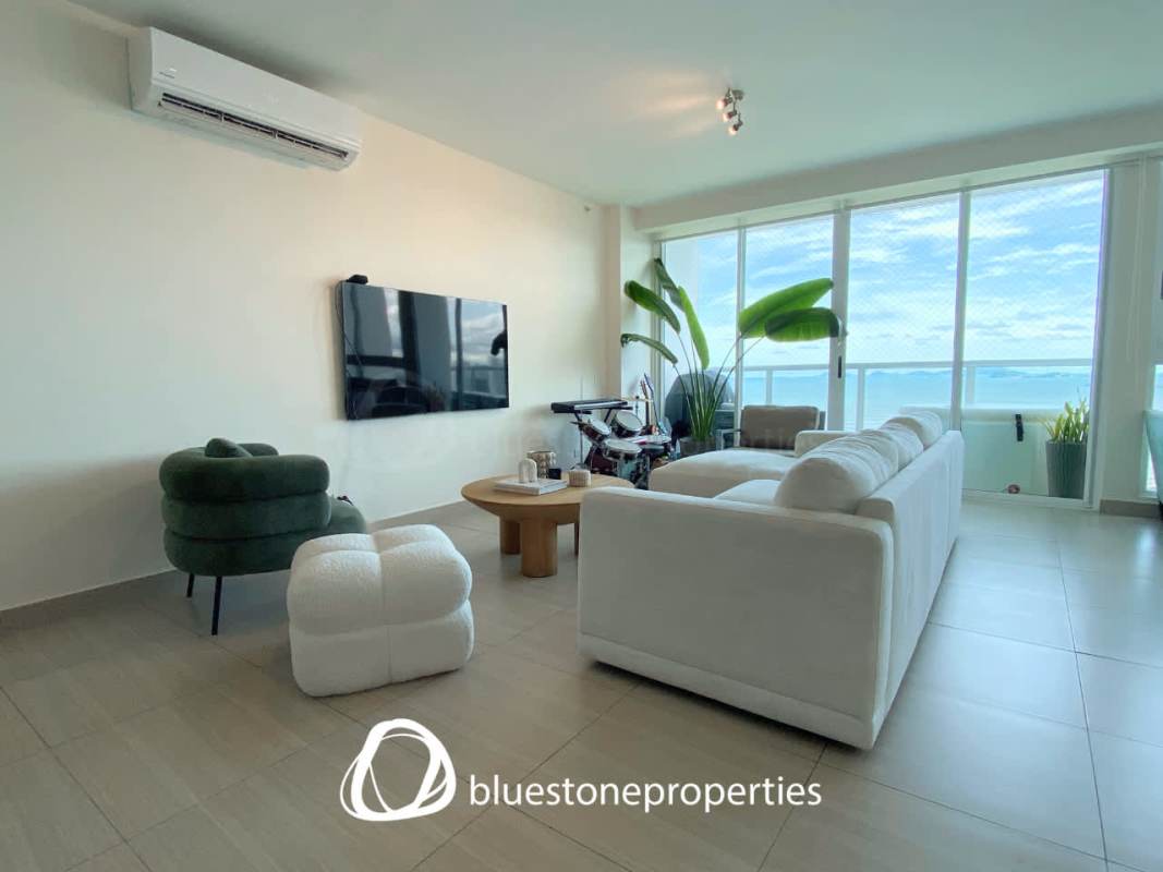 Modern dining area opening to seaview balcony at PH Asia Costa del Este apartment