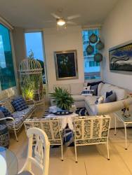 Elegant dining area with large windows featuring Pacific Ocean views at Punta Barco condo