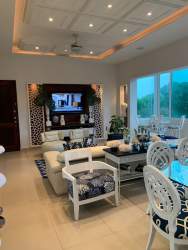 Bright guest bedroom with window in Punta Barco beachfront apartment Panama