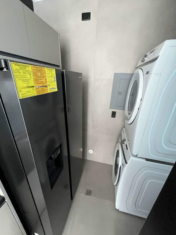 Bedroom with ocean view window at Victory Wellness Tower Panama