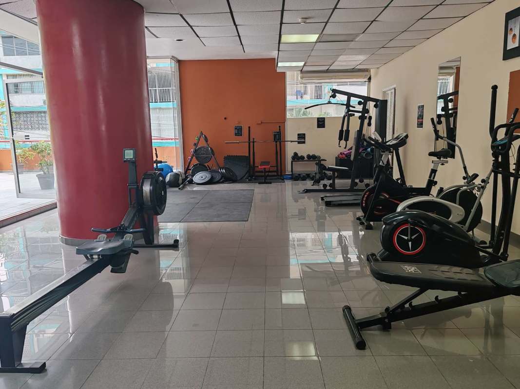Fitness room with equipment overlooking city PH Del Caribe Panama