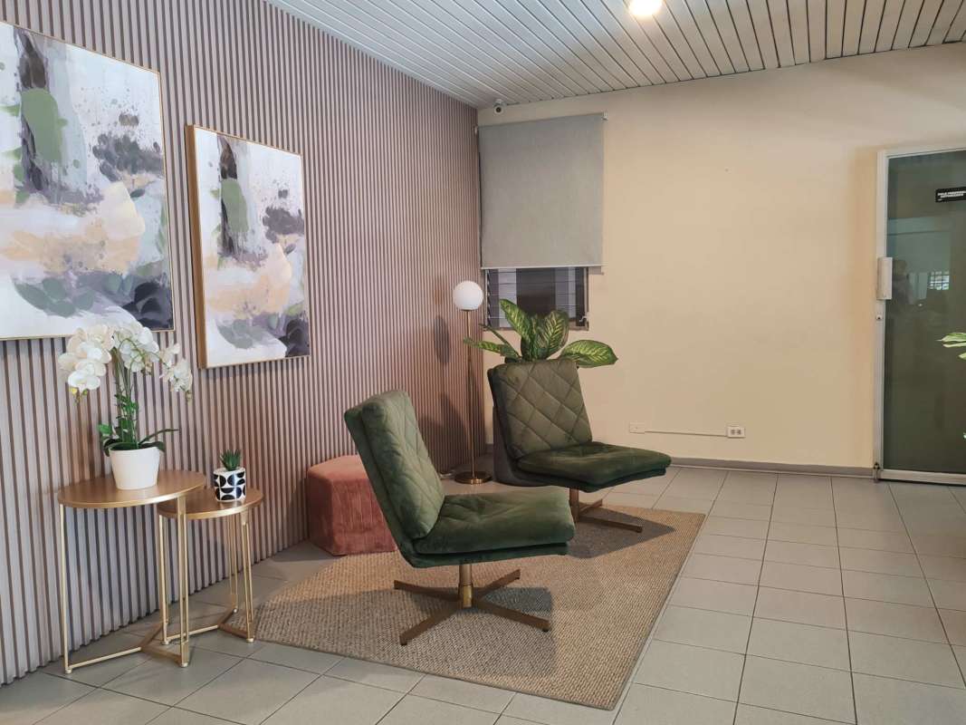 Outdoor pool area surrounded by high-rise towers PH Del Caribe El Cangrejo Panama