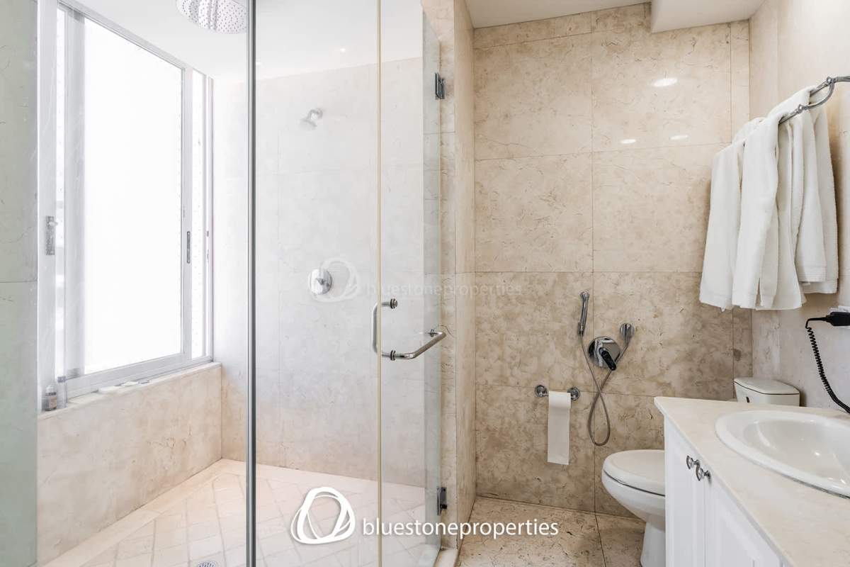 Modern dining space with designer lighting, art features in PH Marbella Tower Panama City