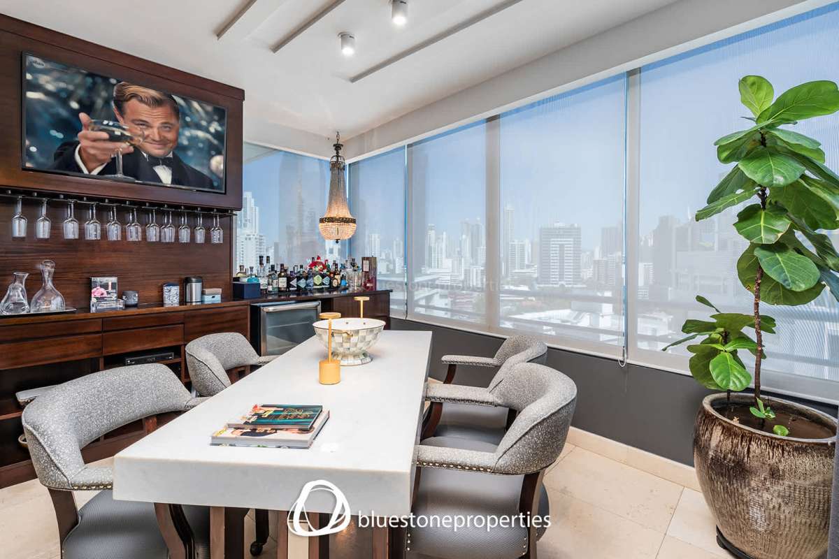 Luxurious bathroom with marble tiles, glass shower enclosure, modern vanity in PH Marbella Tower Panama City