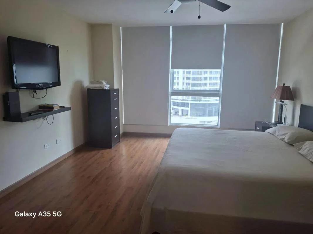 Furnished bedroom with panoramic city skyline views in PH Bayfront Tower Avenida Balboa Panama