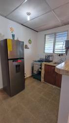 Rustic bohío lounge with picnic table BBQ Malibu Cabins Playa Gorgona Panama