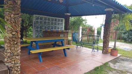 Open kitchen with stove, fridge, microwave at Malibu Cabins Gorgona Panama vacation rental