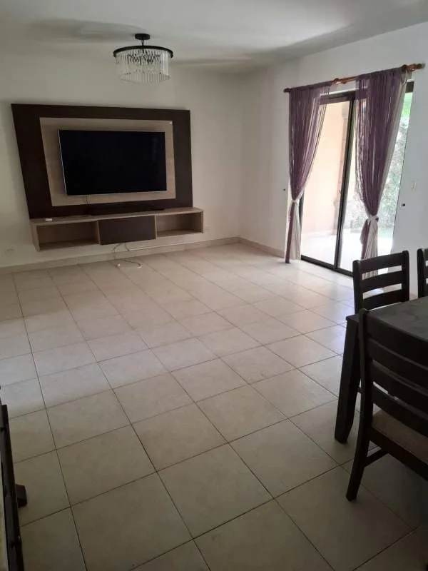Bright living dining area with ceramic floors and sliding doors Costa Sur house for rent Panama