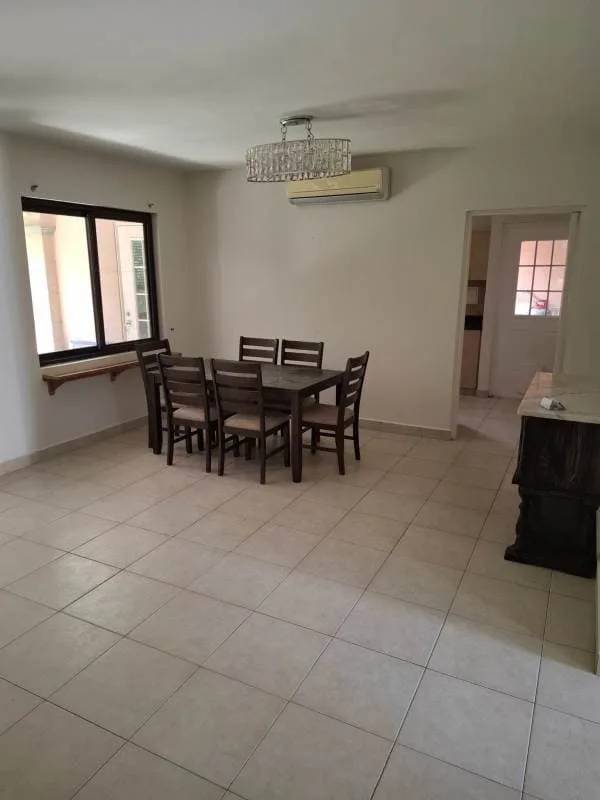 Covered backyard patio terrace with garden in Costa Sur house Panama City rental