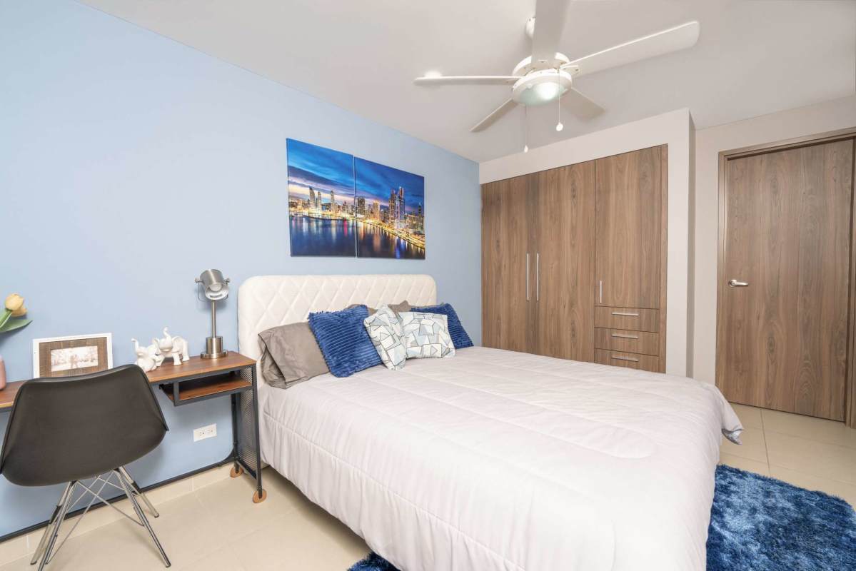 Spacious open-plan living and dining area with floor-to-ceiling windows and city view at PH Spotlight Panama