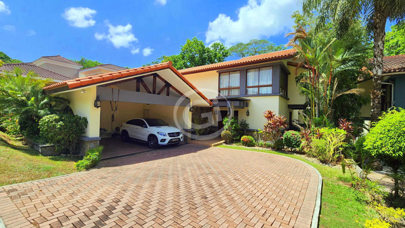 Spacious covered terrace with Jacuzzi, BBQ space, manicured gardens in luxury home Panama