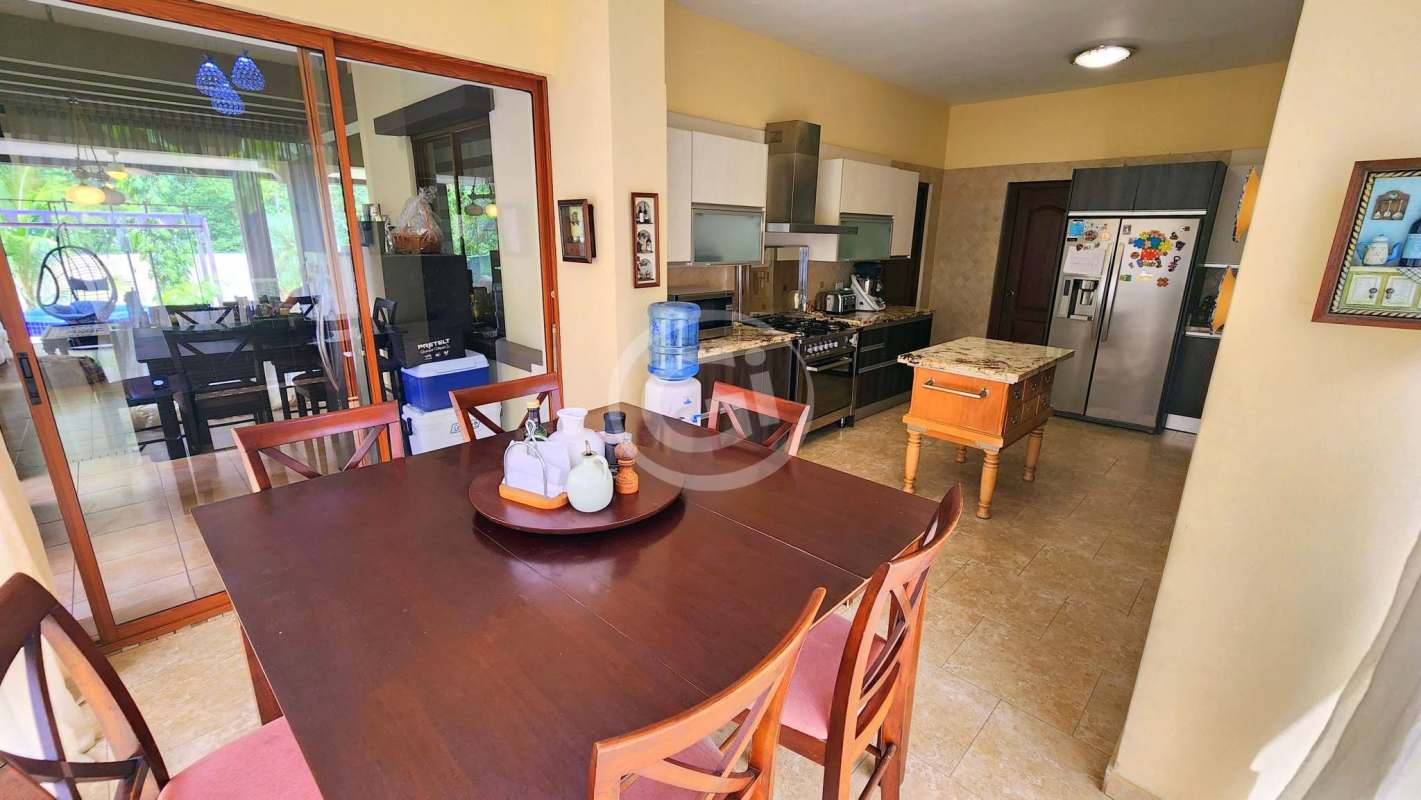 Large glass enclosed air-conditioned terrace with lounge, bar, dining Camino de Cruces home Panama