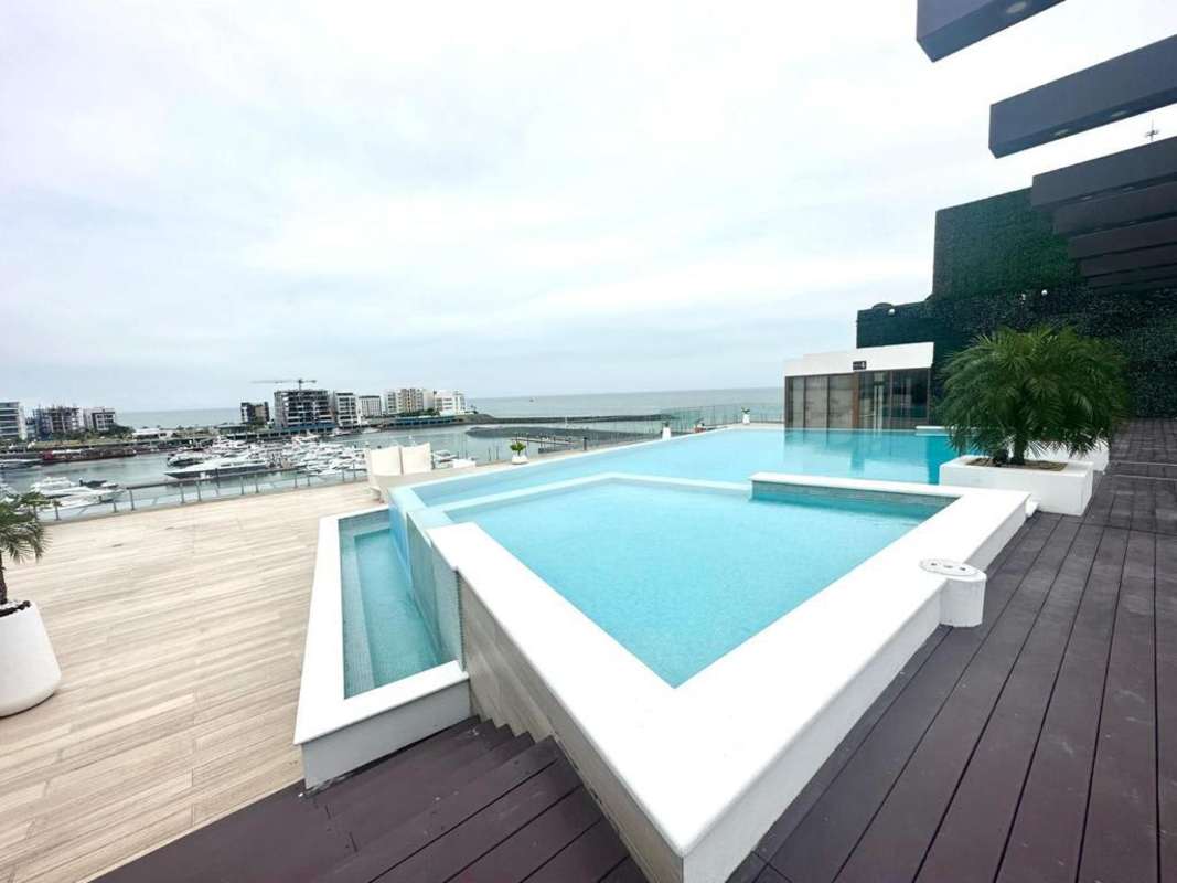 Infinity pool overlooking marina, sun deck, luxury amenities at PH Garden Ocean Reef Islands