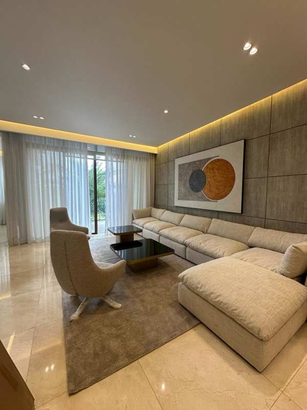 Elegant living room with marble floors, floor-to-ceiling windows to marina view balcony at PH Garden Ocean Reef Islands