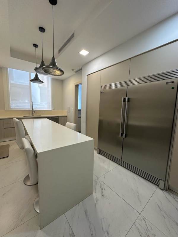 Modern kitchen with granite countertops, island seating, stainless appliances at PH Garden Ocean Reef Islands Panama