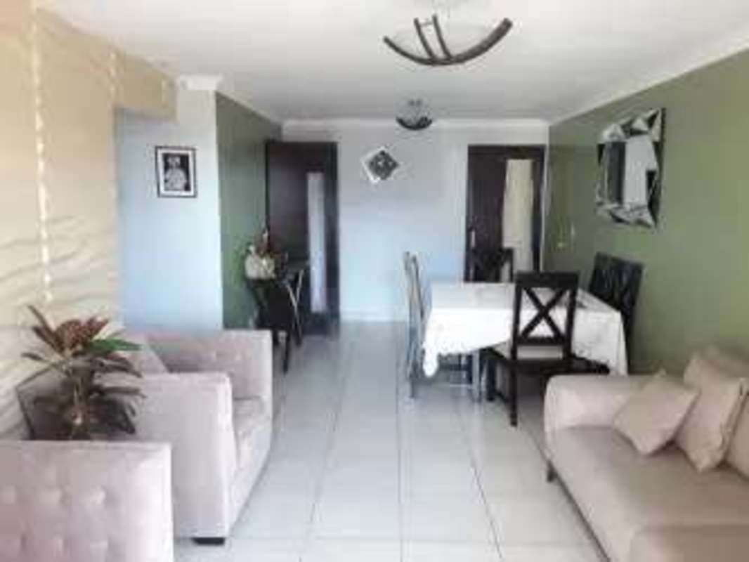 Open plan living and dining room with large window PH Sunset Place Carrasquilla Panama