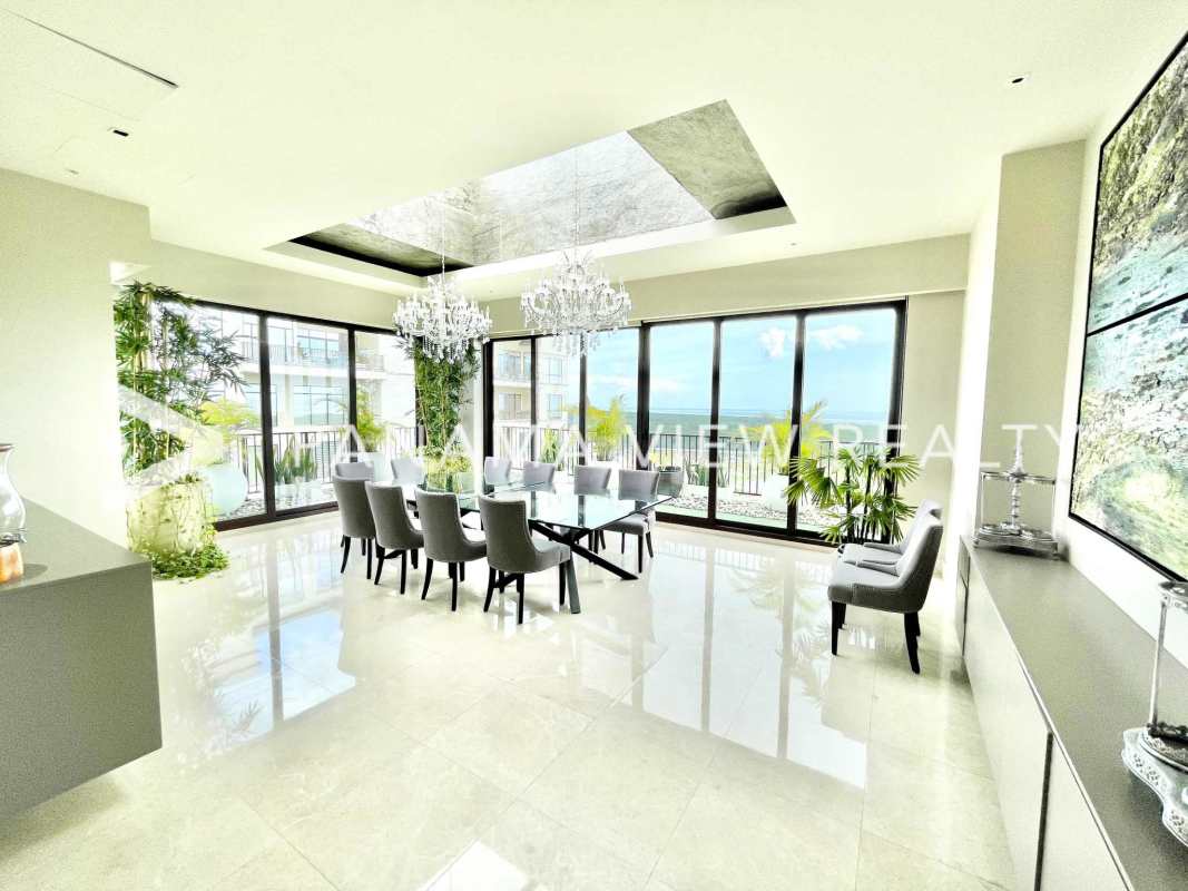 Elegant dining area with marble flooring, panoramic windows in luxury penthouse Panama City