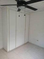 Bedroom with built-in white wardrobe and ceiling fan Panama Pacifico