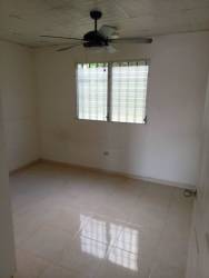 Empty bedroom with fan and tile flooring rental house Panama Pacifico