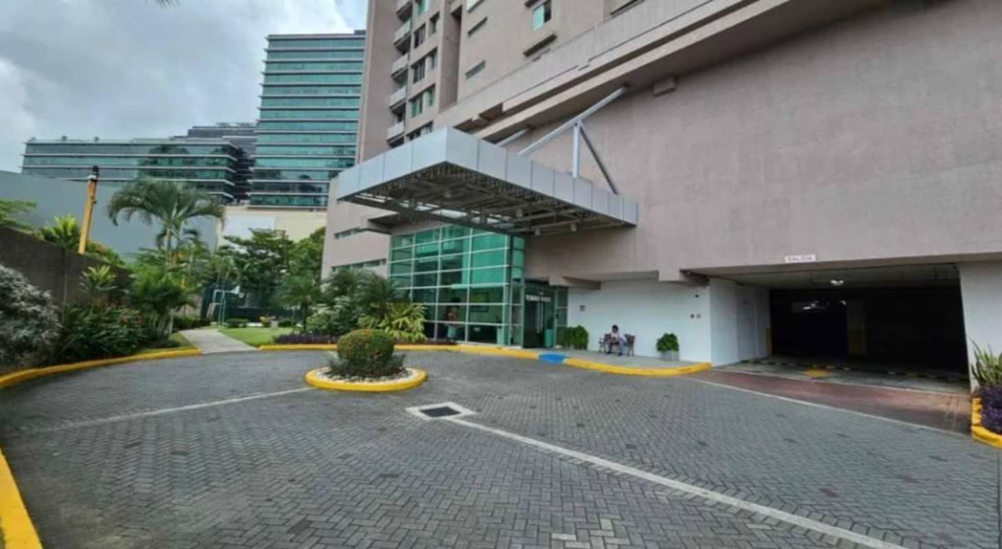 Spacious walk-in closet with open wardrobes and large window PH Costa del Este Panama