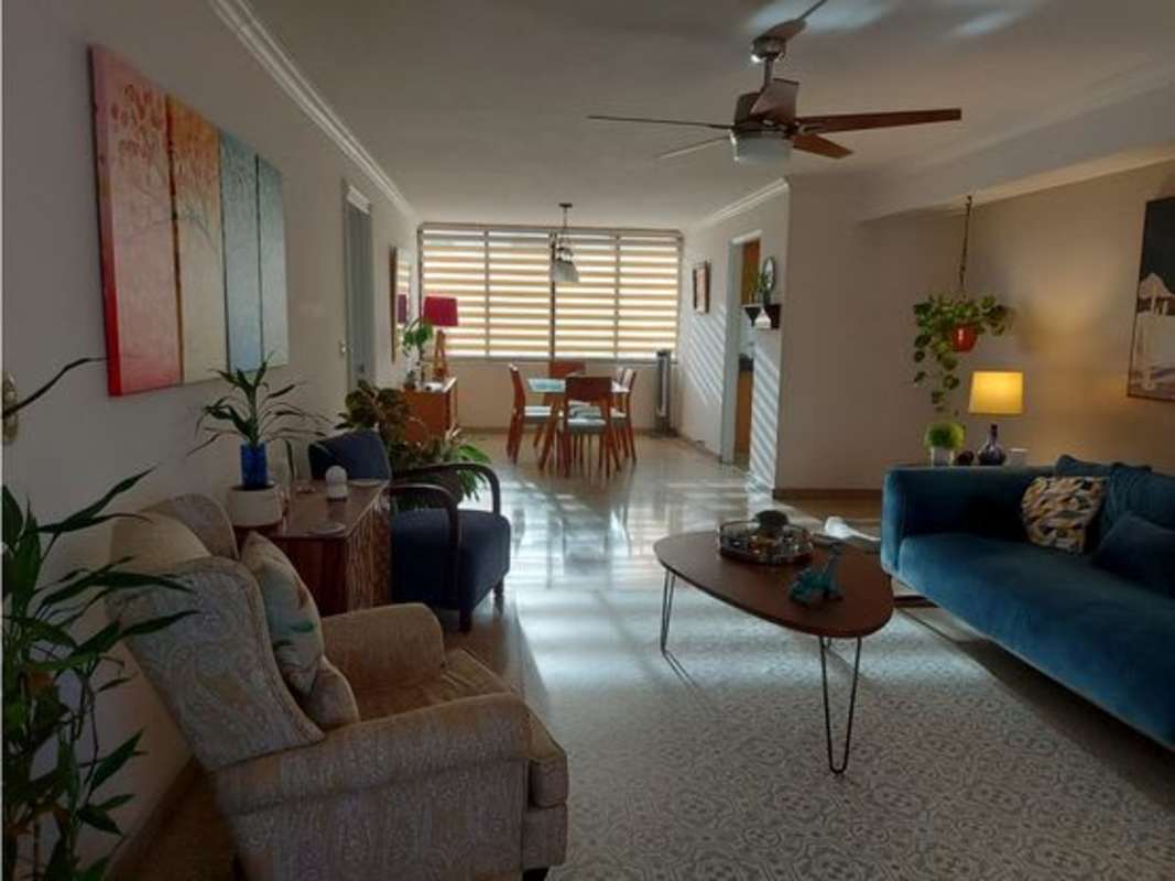 Bedroom with ceiling fan, closet, tile floor, and large window PH La Alameda Betania Panama