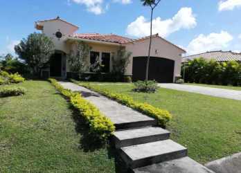 Bright living room with AC windows and tile floor in beach house for sale Panama Hacienda Pacífica