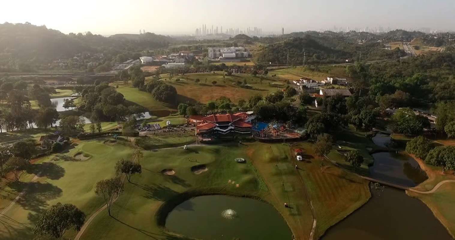 Aerial view of Panama Golf Club golf course, clubhouse, ponds, mature trees