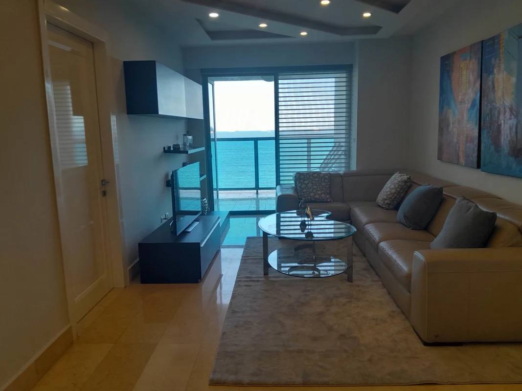 Contemporary bedroom with large windows ocean view and upscale decor at YOO Panama Avenida Balboa