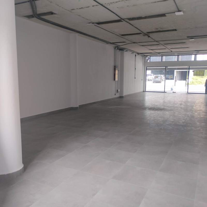 Empty ground floor commercial retail with tiled floor columns and glass storefront Panama