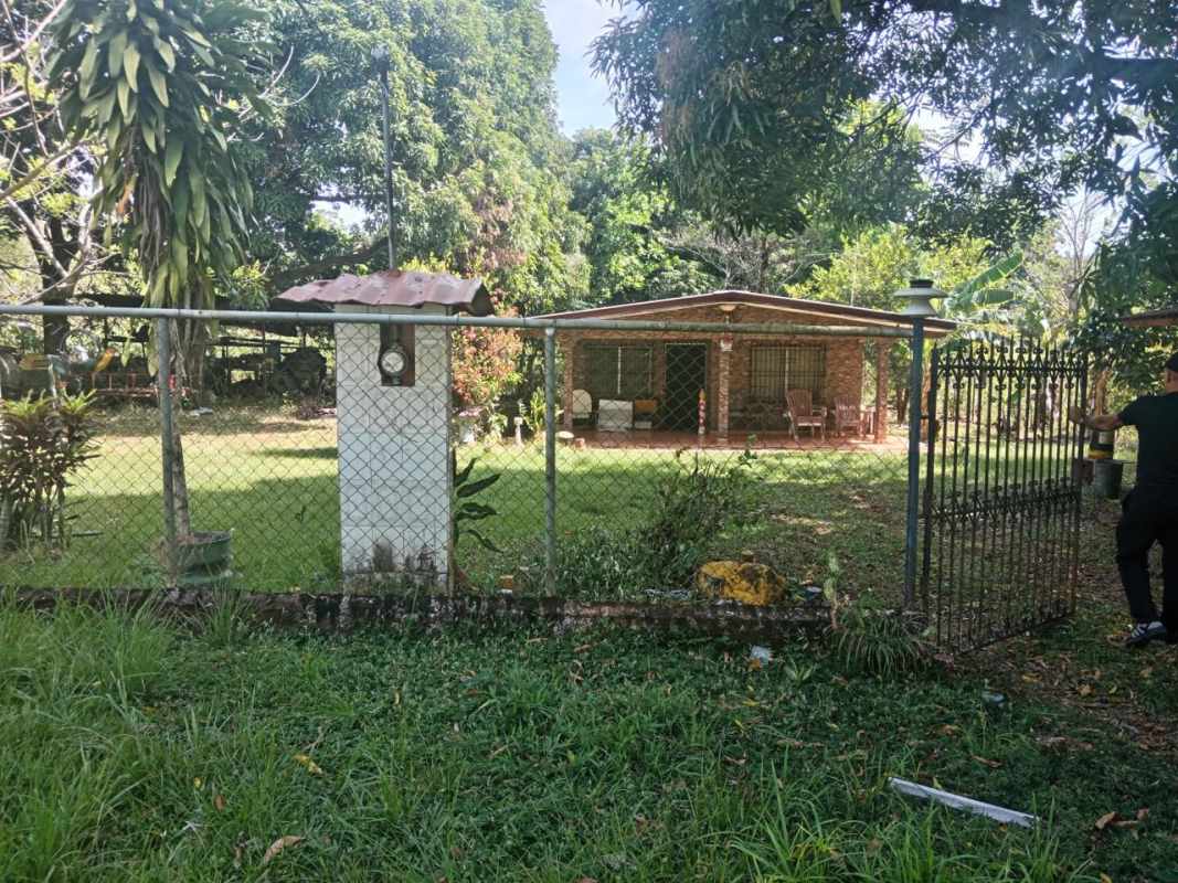 Living room entry with tile floor, security door, rustic decor Panama country property