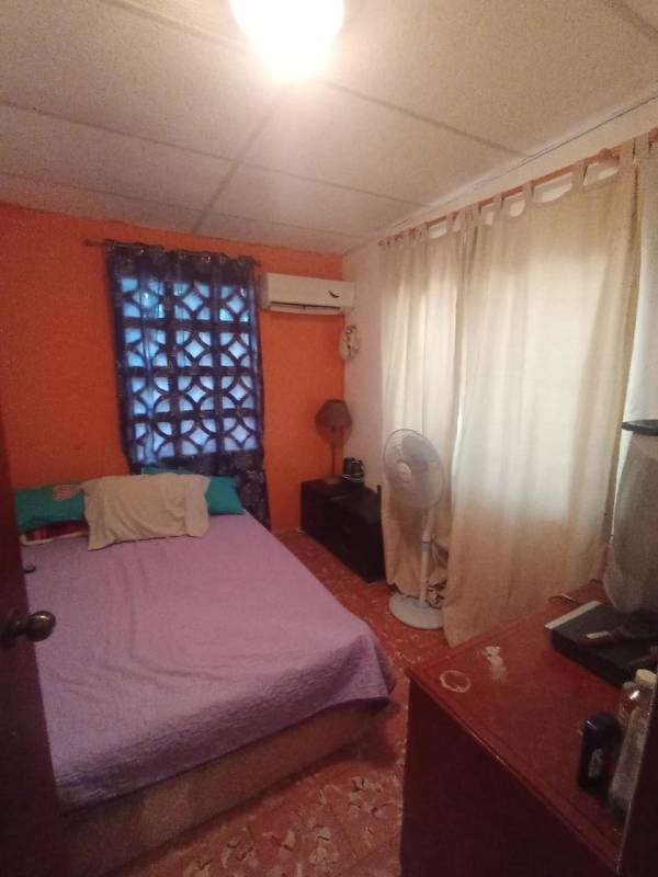 Brick rustic house with porch amid lush green garden San Martin Panama countryside