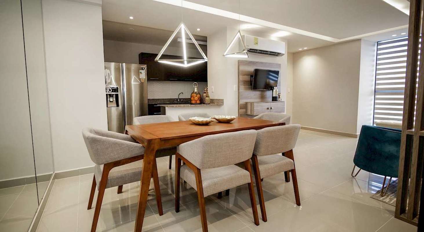 Modern open kitchen dining area with stainless appliances Torre 74 Panama City