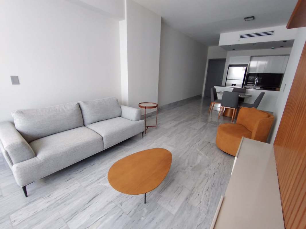 Spacious open living dining kitchen floor plan marble tile PH Nuovo by Armani Panama City