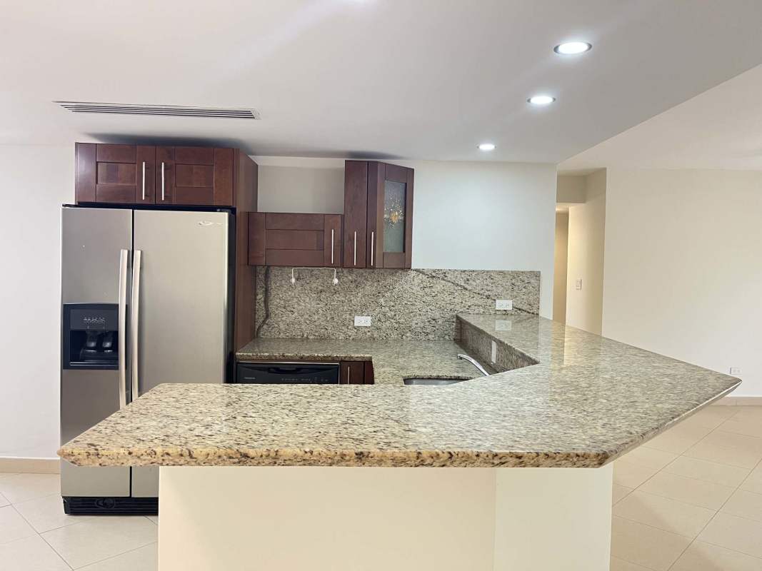 Contemporary kitchen with granite countertops, ample cabinets and natural light Embassy Club Clayton Panama
