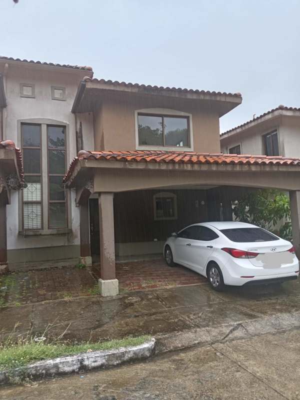Bright living room with ceramic tile floors, large windows and glass door in Brisas del Golf Panama duplex
