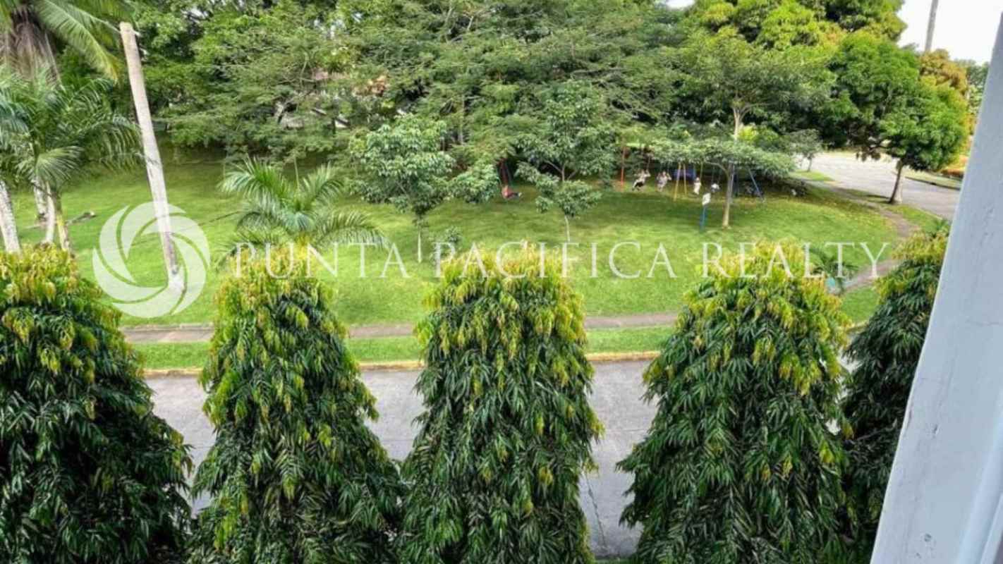 Bedroom with large window, bright light, neutral decor in PH Sun City Albrook