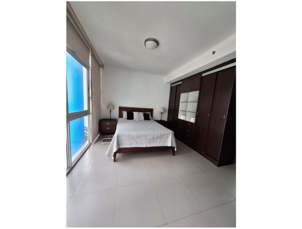Bedroom with built-in closet and large window PH Colores de Bellavista apartment Panama City