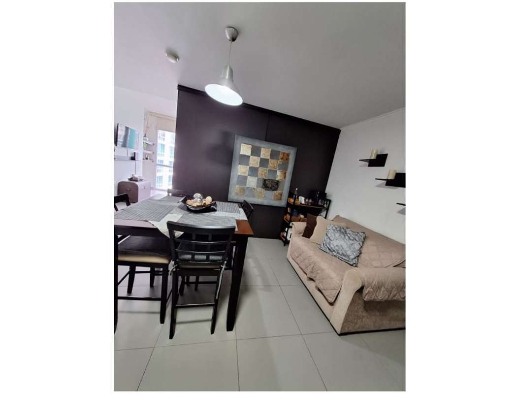 Living and dining space with accent wall modern art in PH Colores de Bellavista Panama