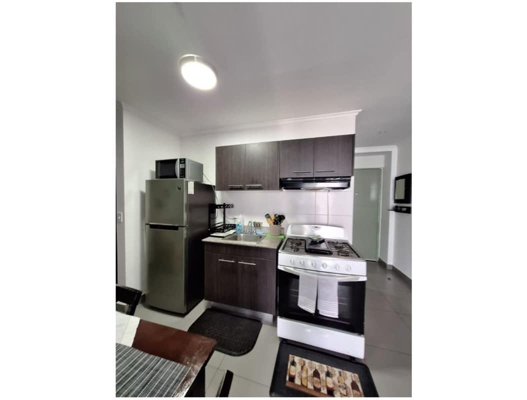 Bedroom with built-in wardrobe large window tile floor PH Colores de Bellavista Panama