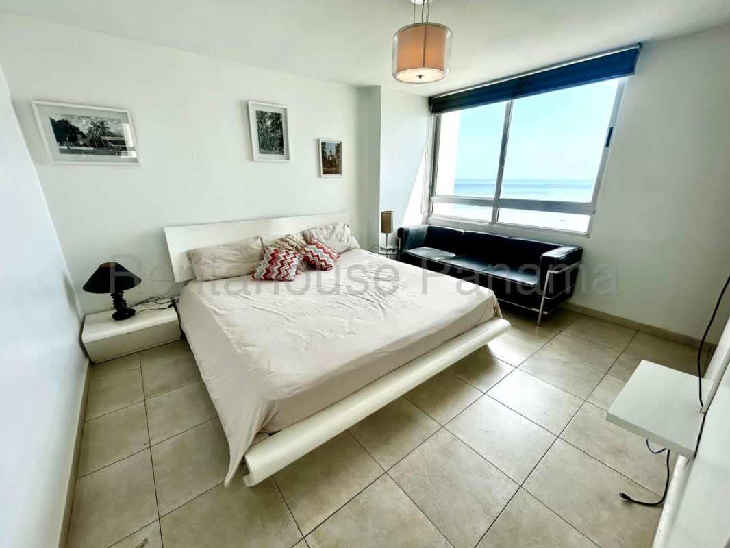 Kitchen with granite countertops, wood cabinets and stainless steel appliances in PH Terrawind San Francisco Panama