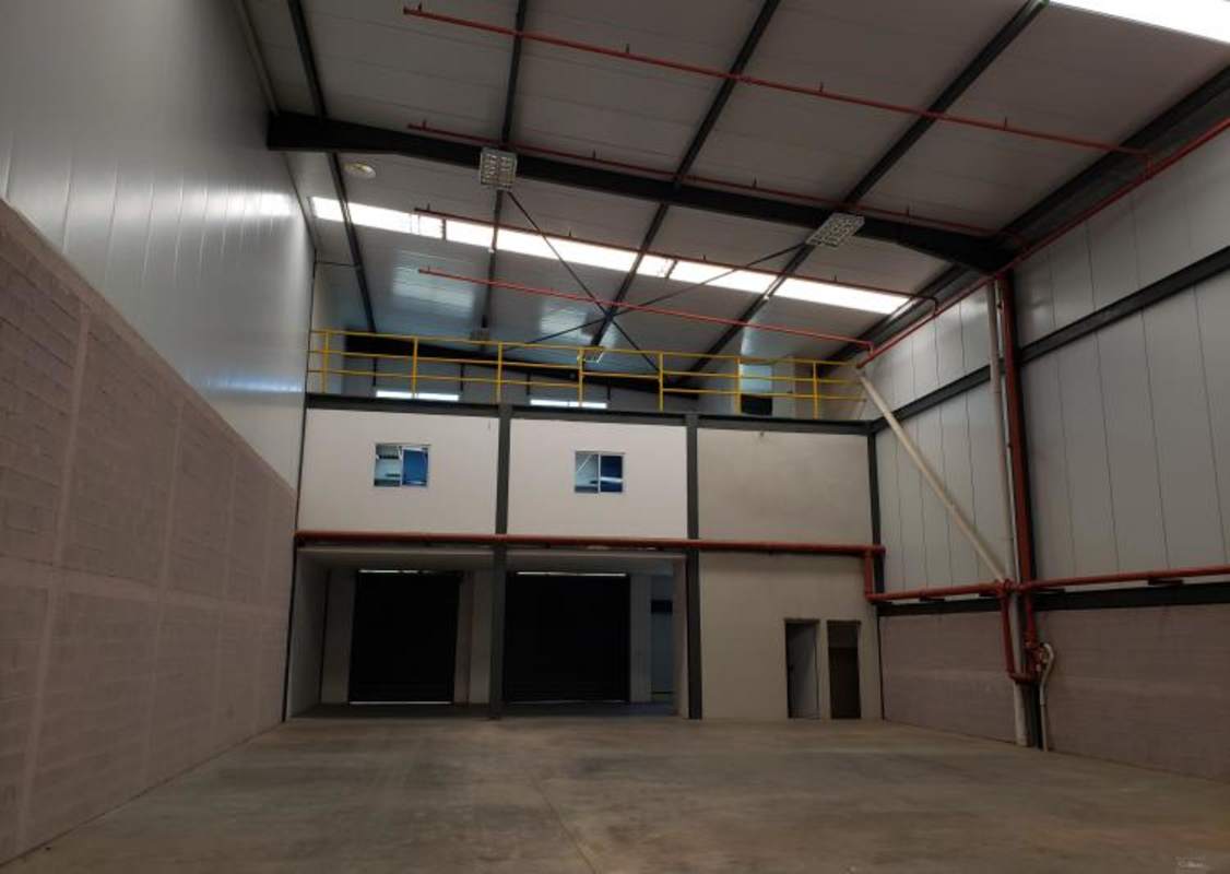 Industrial warehouse loading dock with rolling shutter door and concrete ramp in Panama