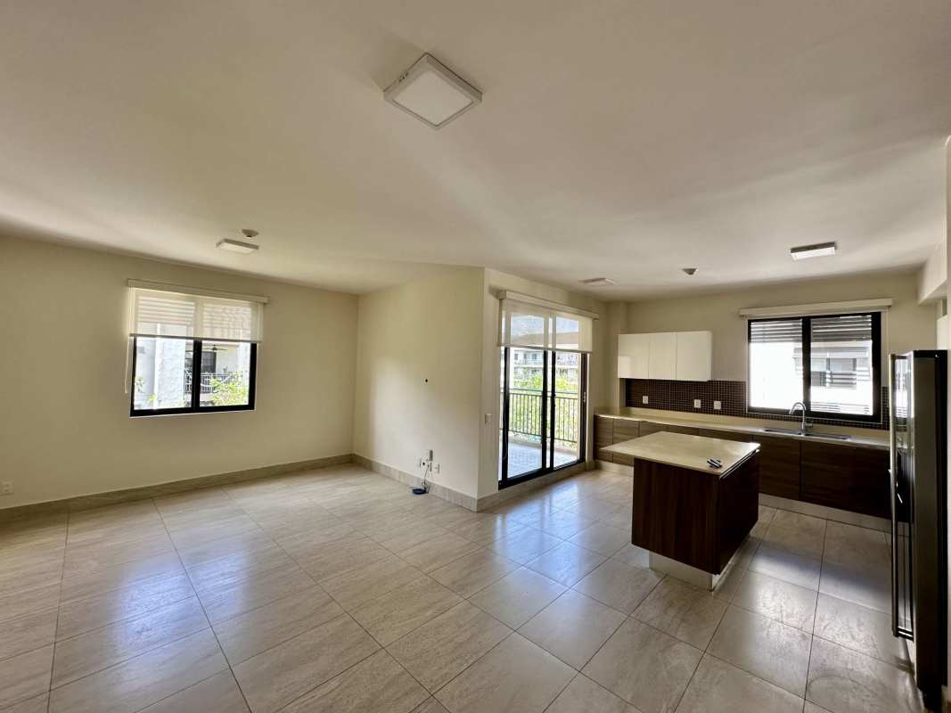 Large covered balcony terrace overlooking gardens in Panama Pacifico apartment at River Valley residences