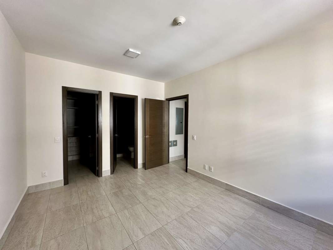 Swimming pool surrounded by lush gardens in River Valley community Panama Pacifico residential complex